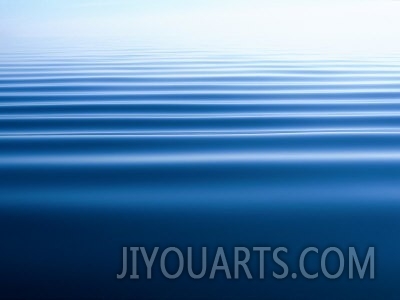 Small Gentle Ripples Move Across the Calm Surface of the Arctic Ocean