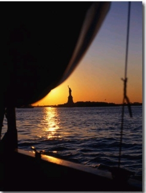 Statue of Liberty at Sunset from Staten Island Ferry, New York City, New York, USA