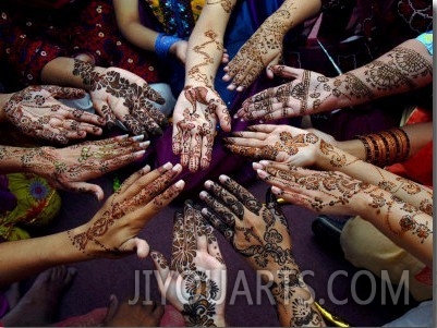 Pakistani Girls Show Their Hands Painted with Henna Ahead of the Muslim Festival of Eid Al Fitr