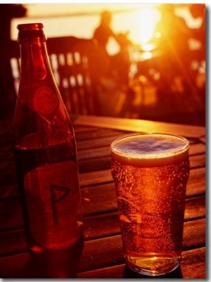 Bottle and Glass of Beer by Lake Vattern at Sunset, Motala, Ostergotland, Sweden