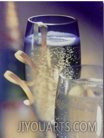 Champagne in Glasses with Ribbon and Bottle Behind