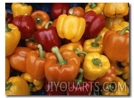 Red, Orange and Yellow Bell Peppers on Display in a Venice Market