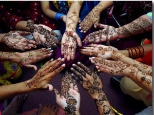 Pakistani Girls Show Their Hands Painted with Henna Ahead of the Muslim Festival of Eid Al Fitr