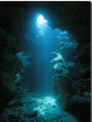 A Beam of Sunlight Illuminates an Underwater Cave