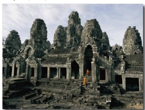 Monks in Orange Robes Stand on the Step Outside a Buddhist Temple