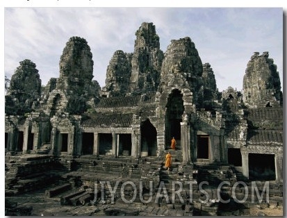 Monks in Orange Robes Stand on the Step Outside a Buddhist Temple