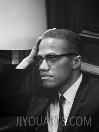 Malcolm X waits at Martin Luther King Press Conference, 1964