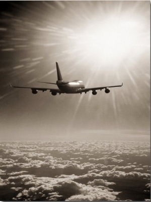 Airplane Flying Through Clouds