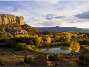 Pond Is Seen Next to Kitchen Mesa with Pedernal Peak in the Distance