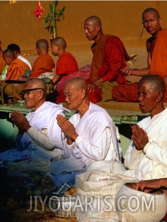 Nuns Praying at Pha That Luang Temple During the Full Moon Temple Festival, Vientiane, Laos