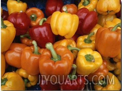 Red, Orange and Yellow Bell Peppers on Display in a Venice Market